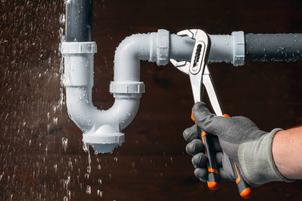 Professional Drain Cleaning technician working in Amana, IA